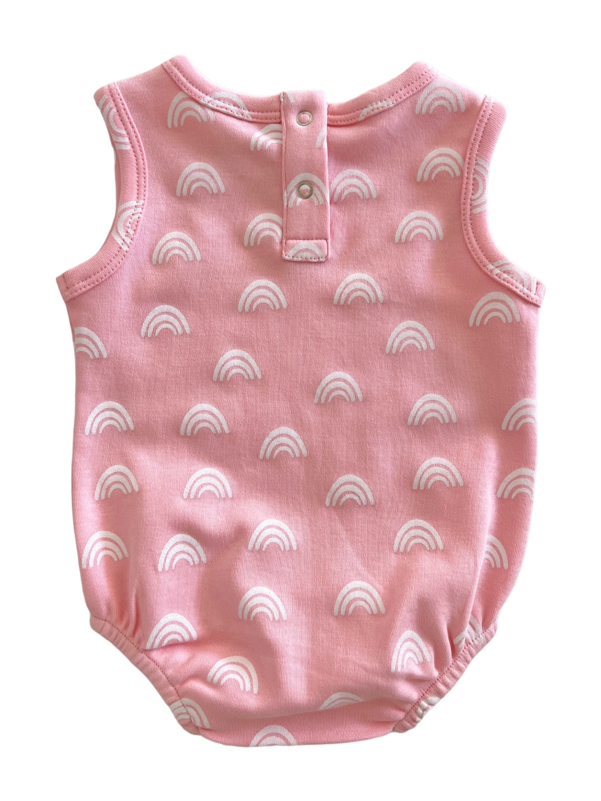 Pink baby romper featuring a playful white rainbow pattern and snap closure at the back.