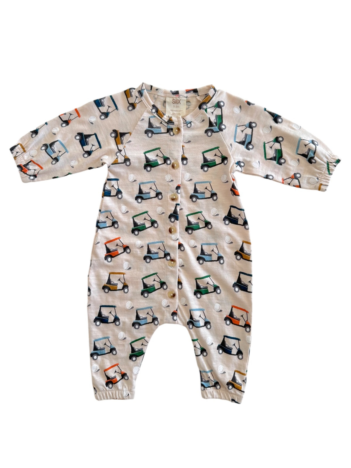 Beige onesie featuring colorful golf cart patterns and button closure, perfect for toddlers.