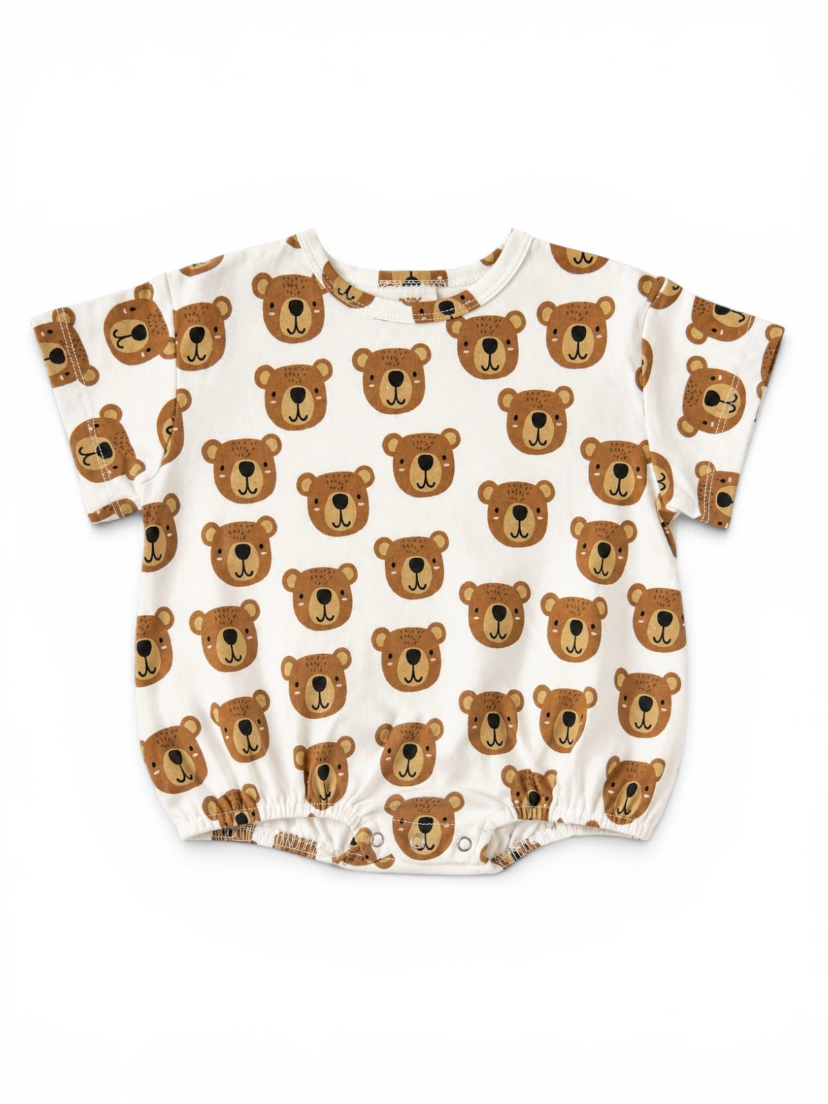Short-sleeve baby shirt featuring a playful bear face pattern on a cream background.
