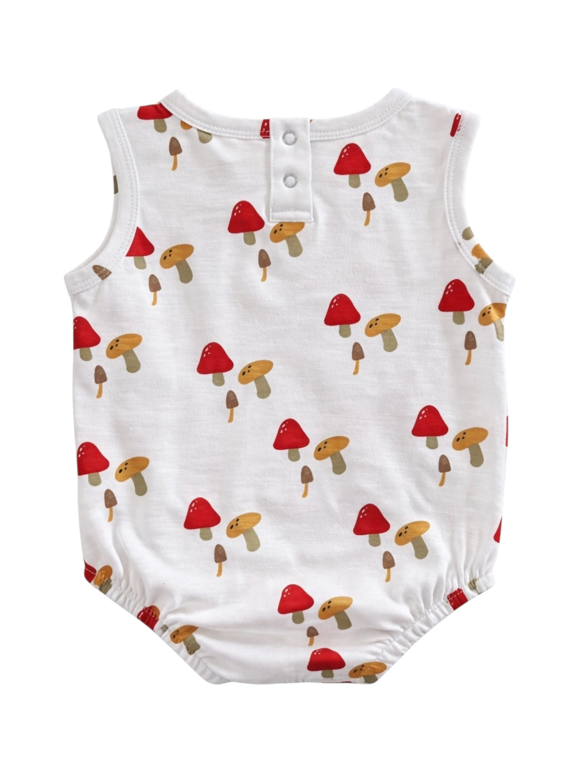 White baby romper with colorful mushroom pattern, featuring red and tan mushrooms on the back.