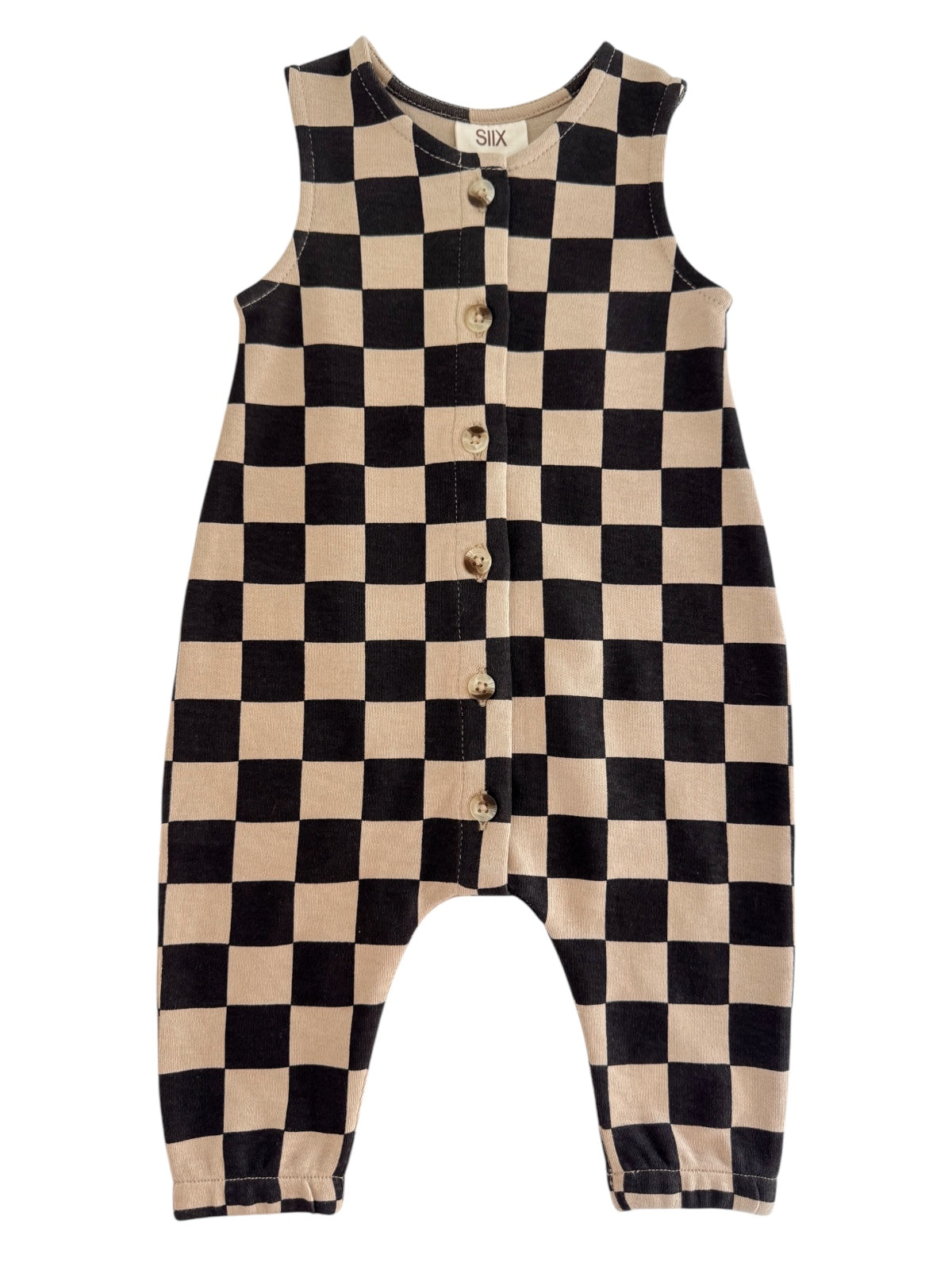 Black and beige checkered sleeveless romper with buttons down the front.