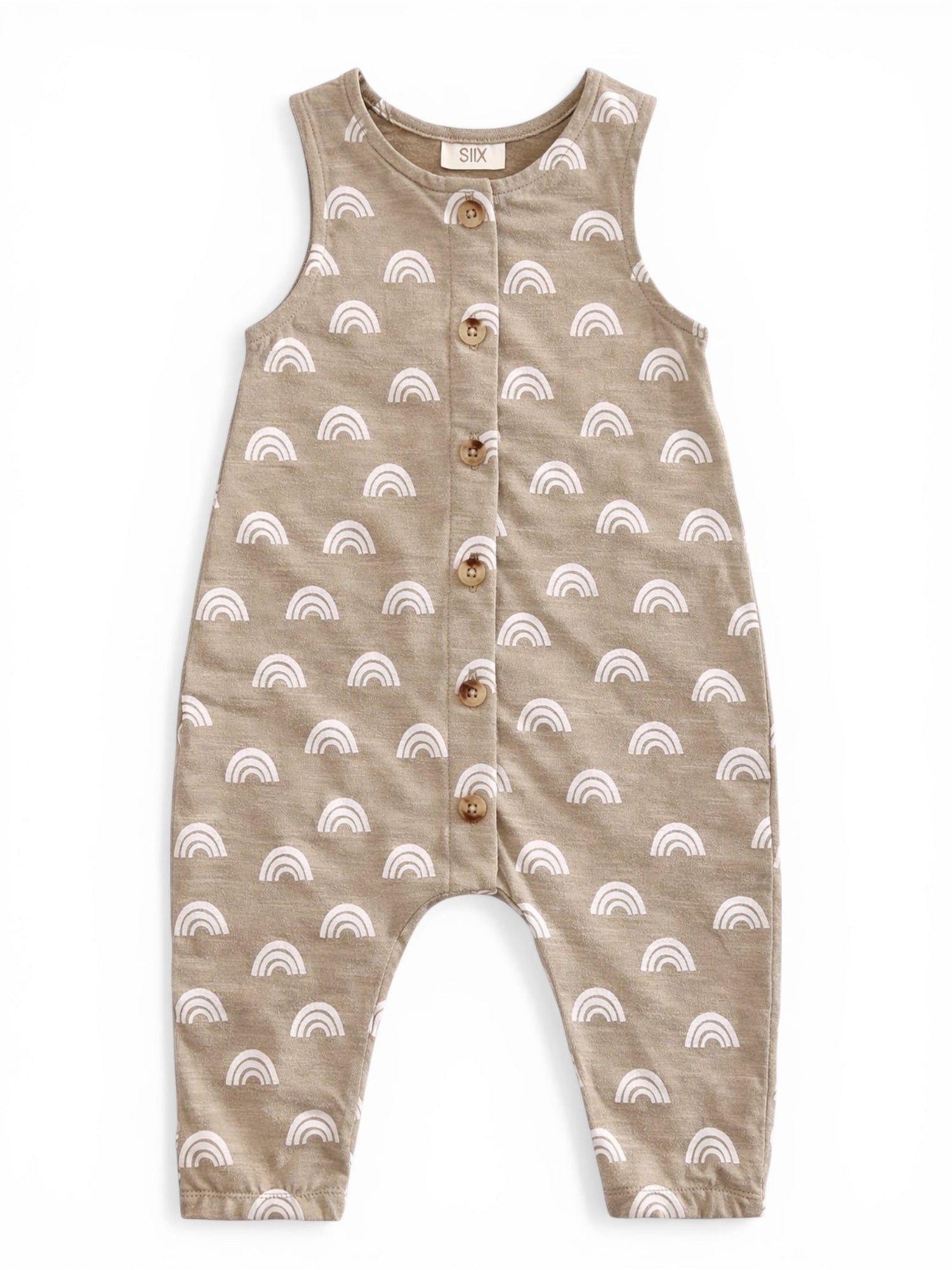 Tan romper with white rainbow patterns and wooden buttons, designed for infants.