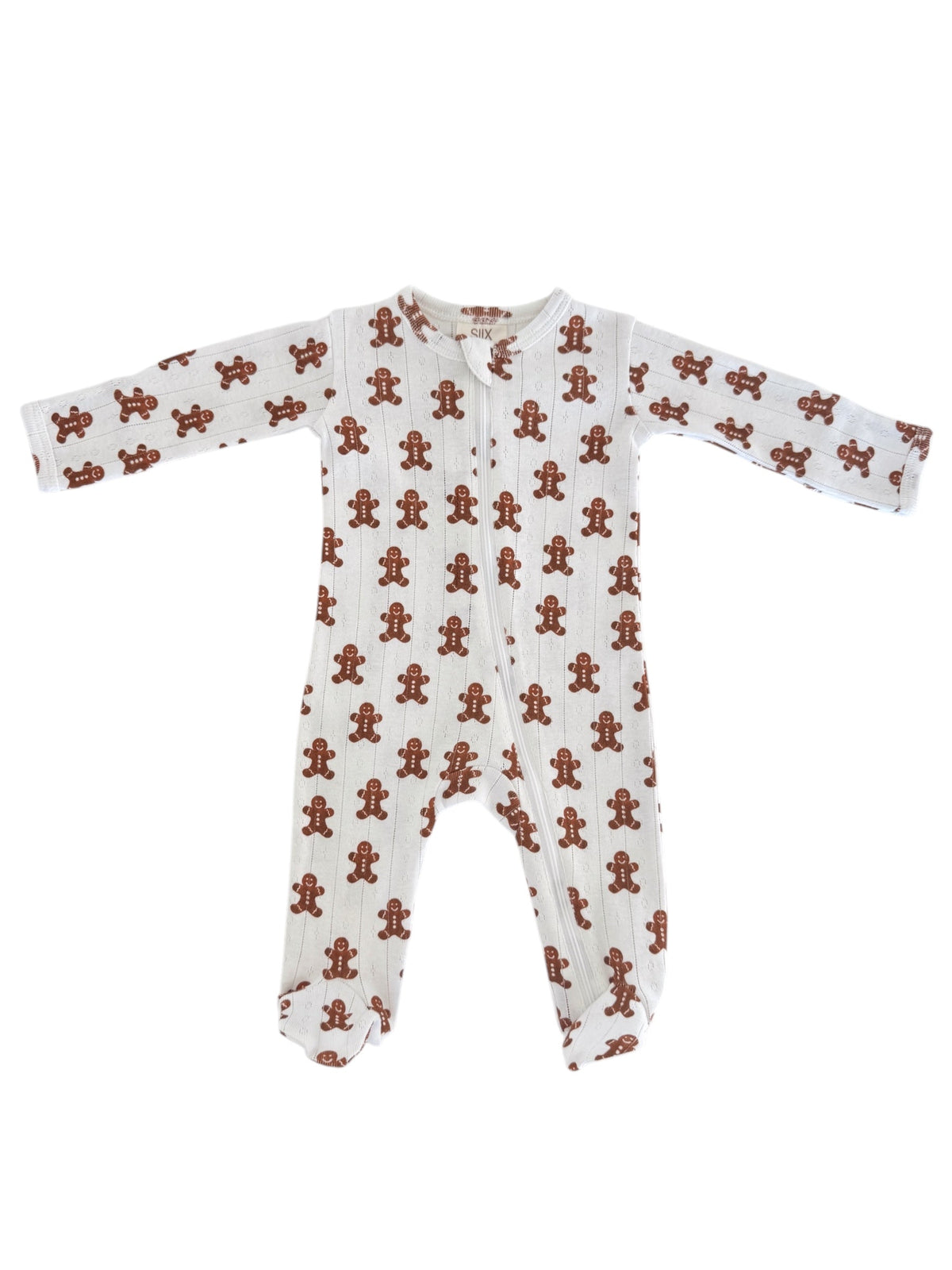 White baby onesie with gingerbread man prints, featuring long sleeves and a zippered front.