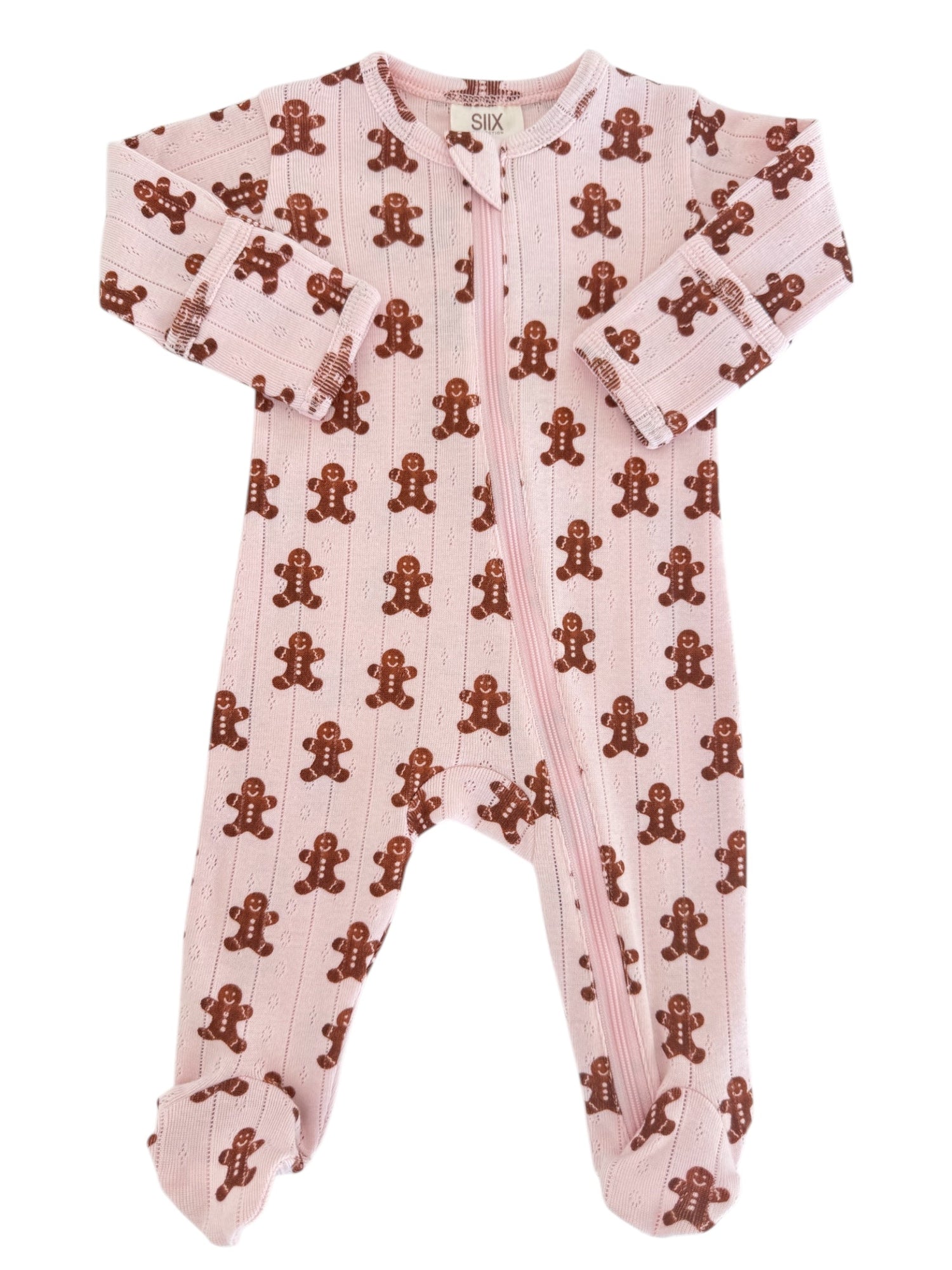 Pink one-piece baby pajamas featuring brown gingerbread man pattern. Zipper closure for easy dressing.
