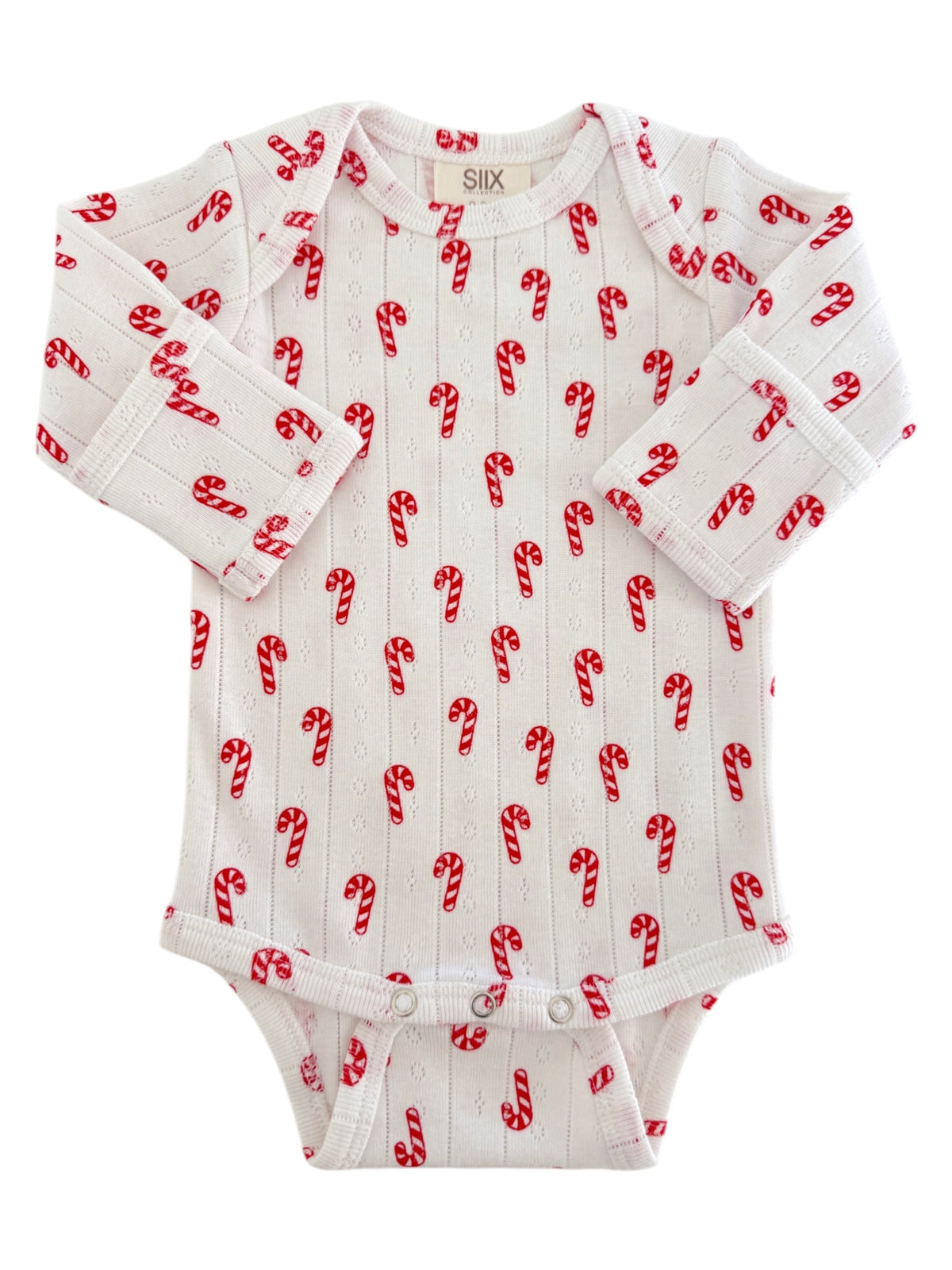 White baby onesie with red candy cane patterns, perfect for festive occasions. Long sleeves and button closures at the bottom.