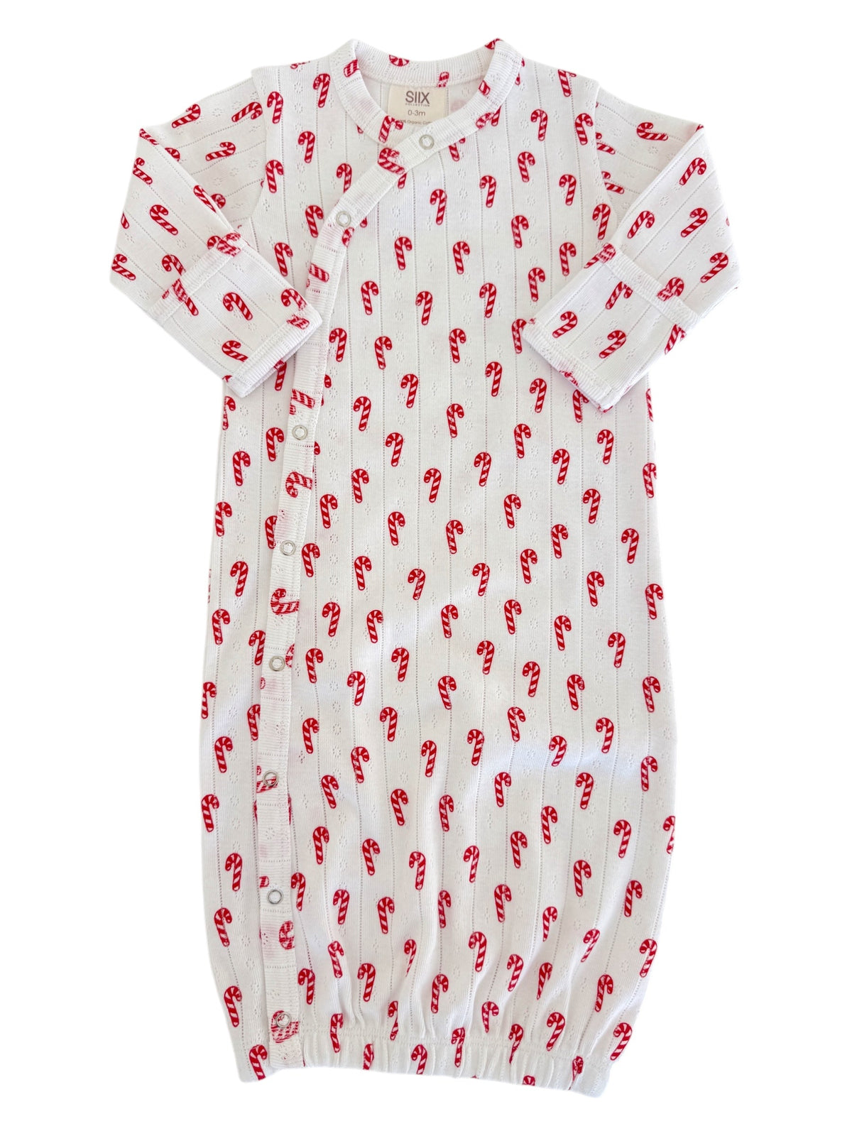 White baby gown with red candy cane print and snap buttons, suitable for newborns up to 3 months.