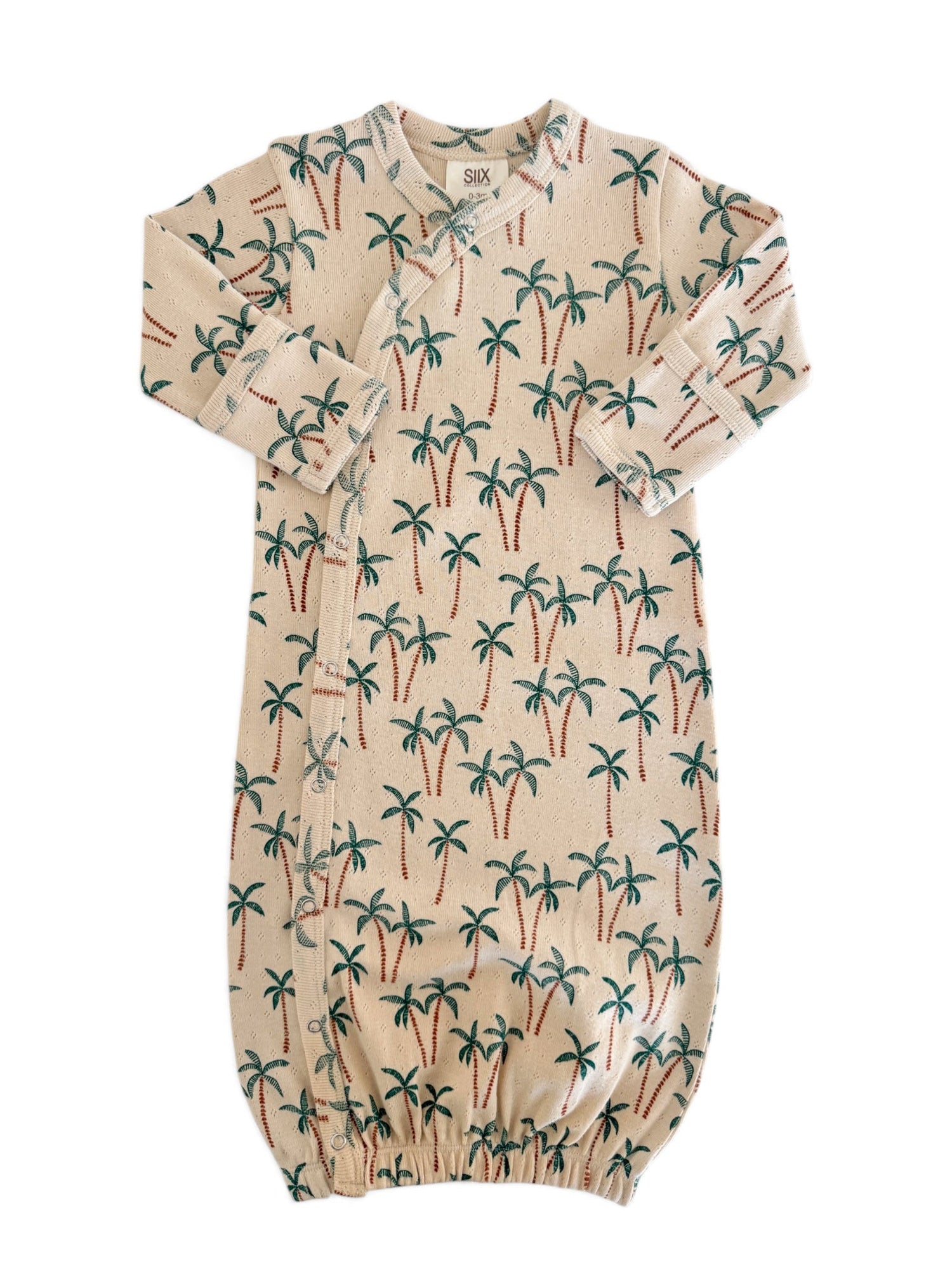 Baby sleep sack featuring a palm tree print on a light background, soft fabric, and snap closure design.