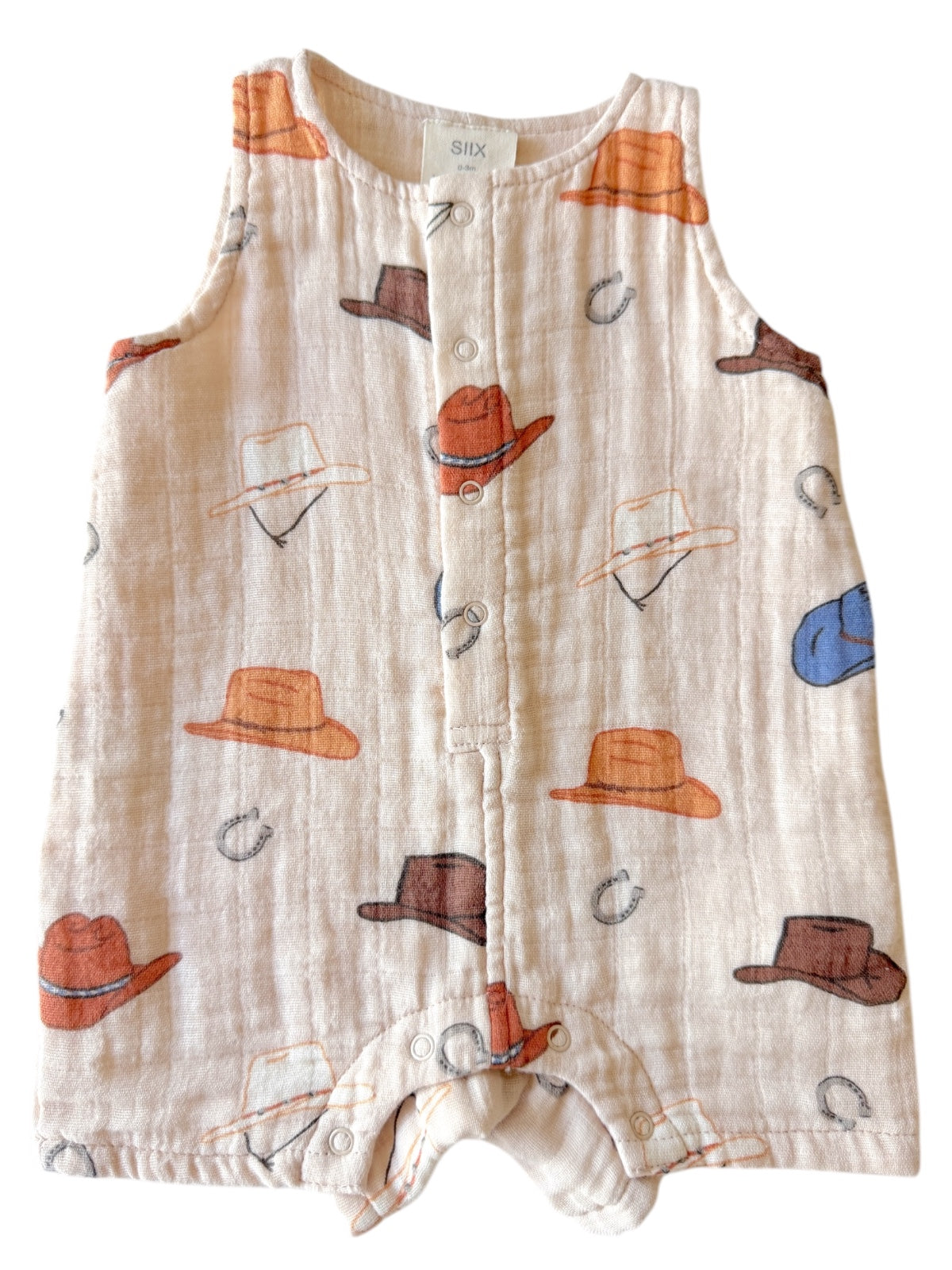 Infant onesie with colorful hat patterns, featuring buttons down the front and a soft, breathable fabric.