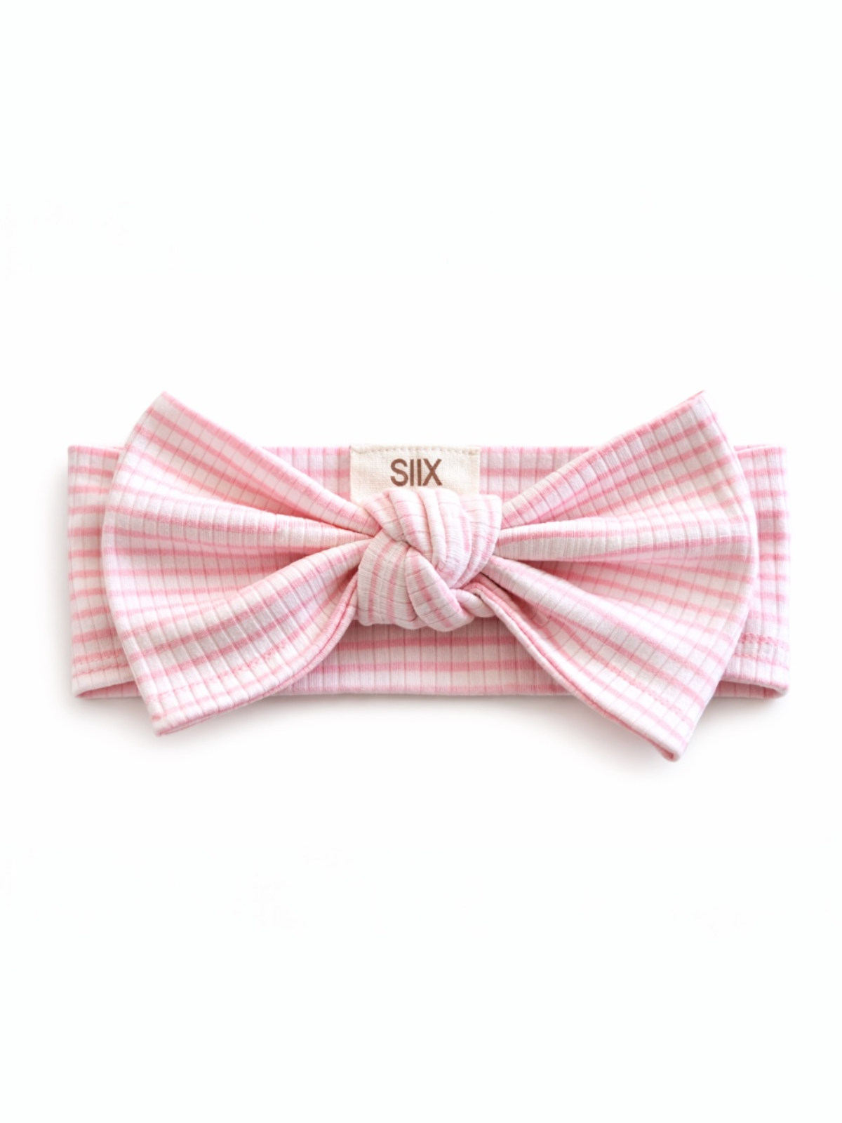 Pink gingham headband with a large bow and logo tag, perfect for casual or stylish outfits.