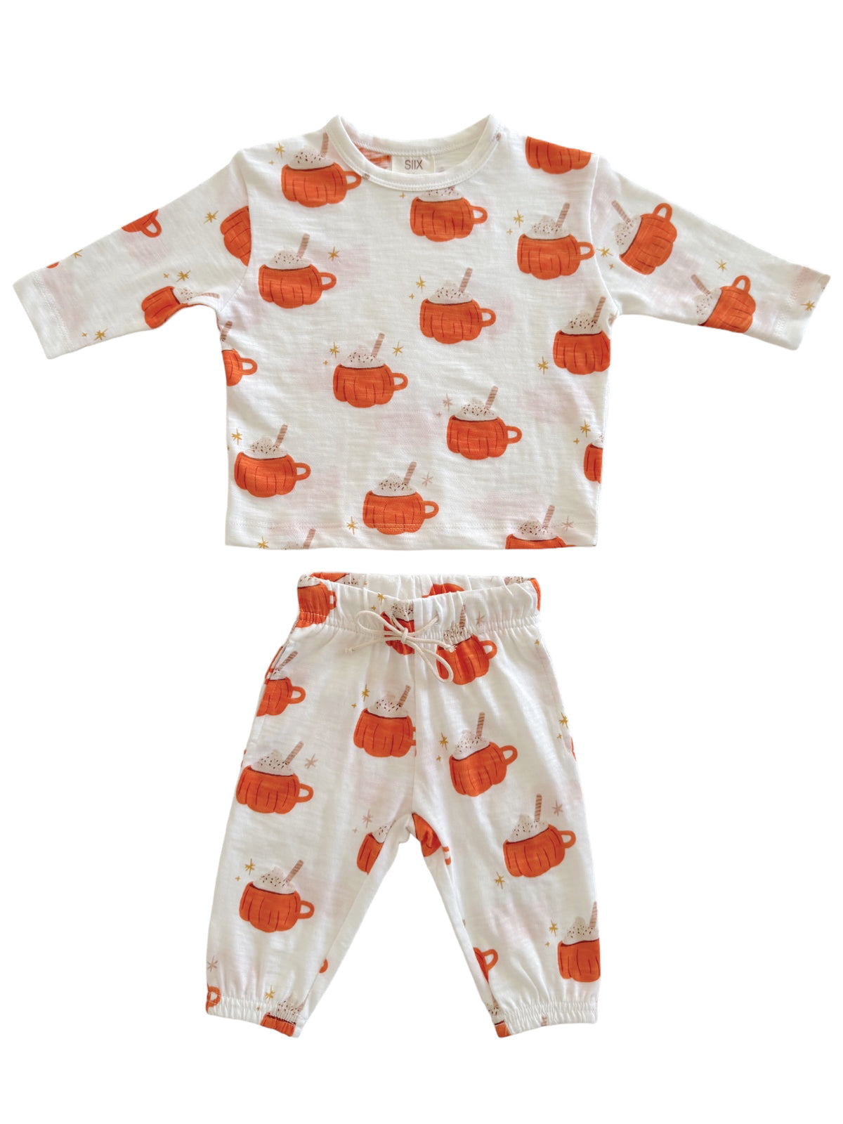 Children's pajama set featuring patterned orange mugs and cream, long-sleeve top with matching pants.