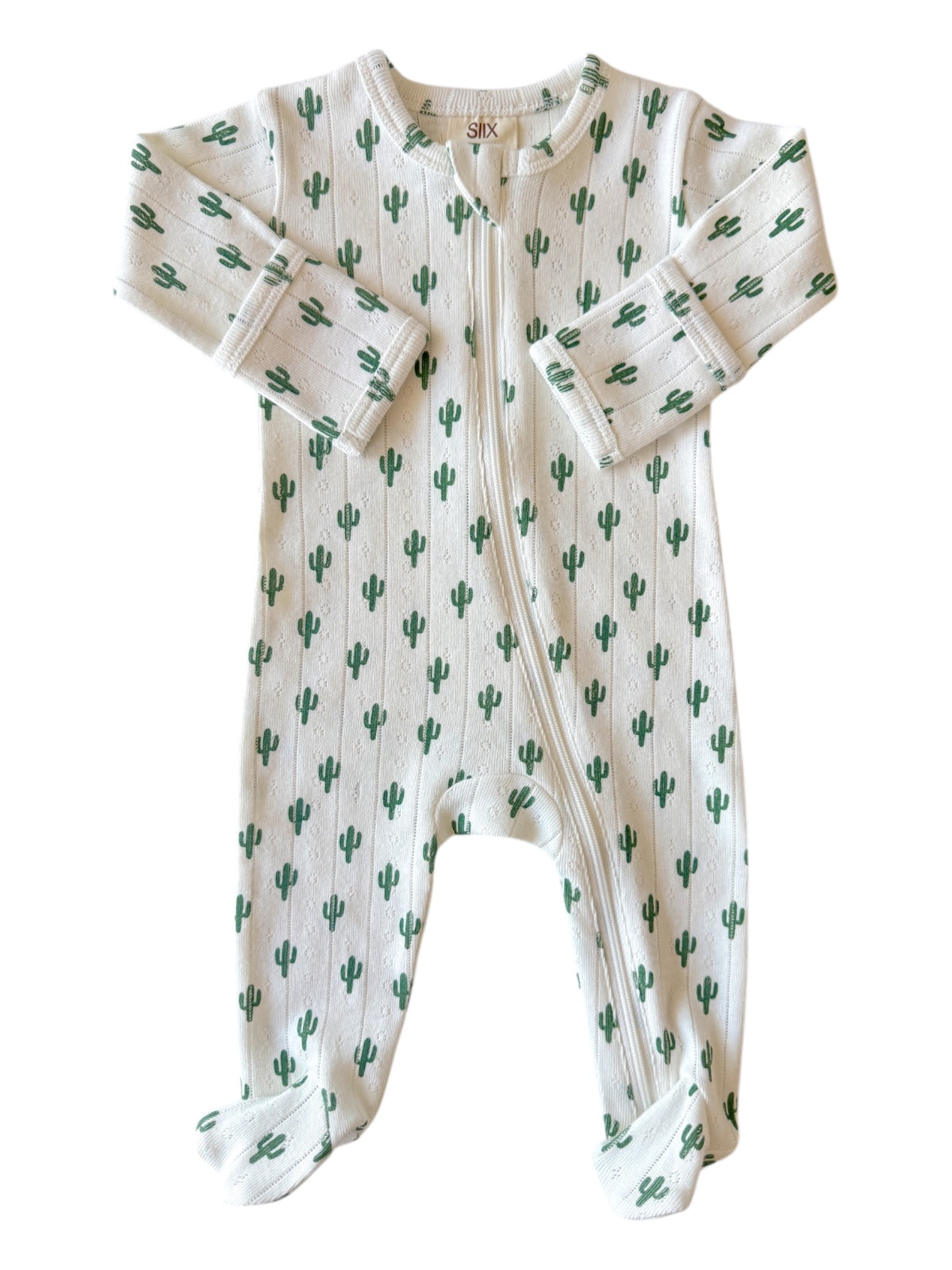 White baby onesie featuring a green cactus pattern, with long sleeves and a front zipper.