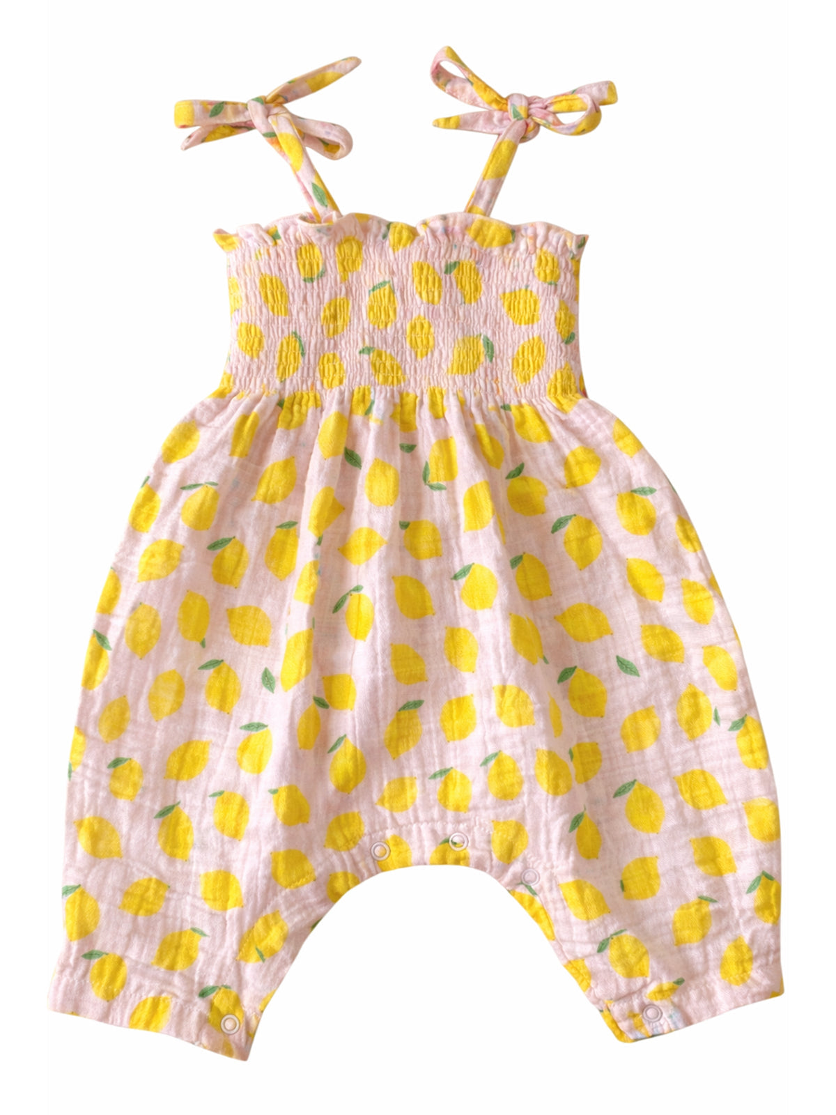 Pink baby romper with yellow lemon print and tie straps, designed for comfort and style.