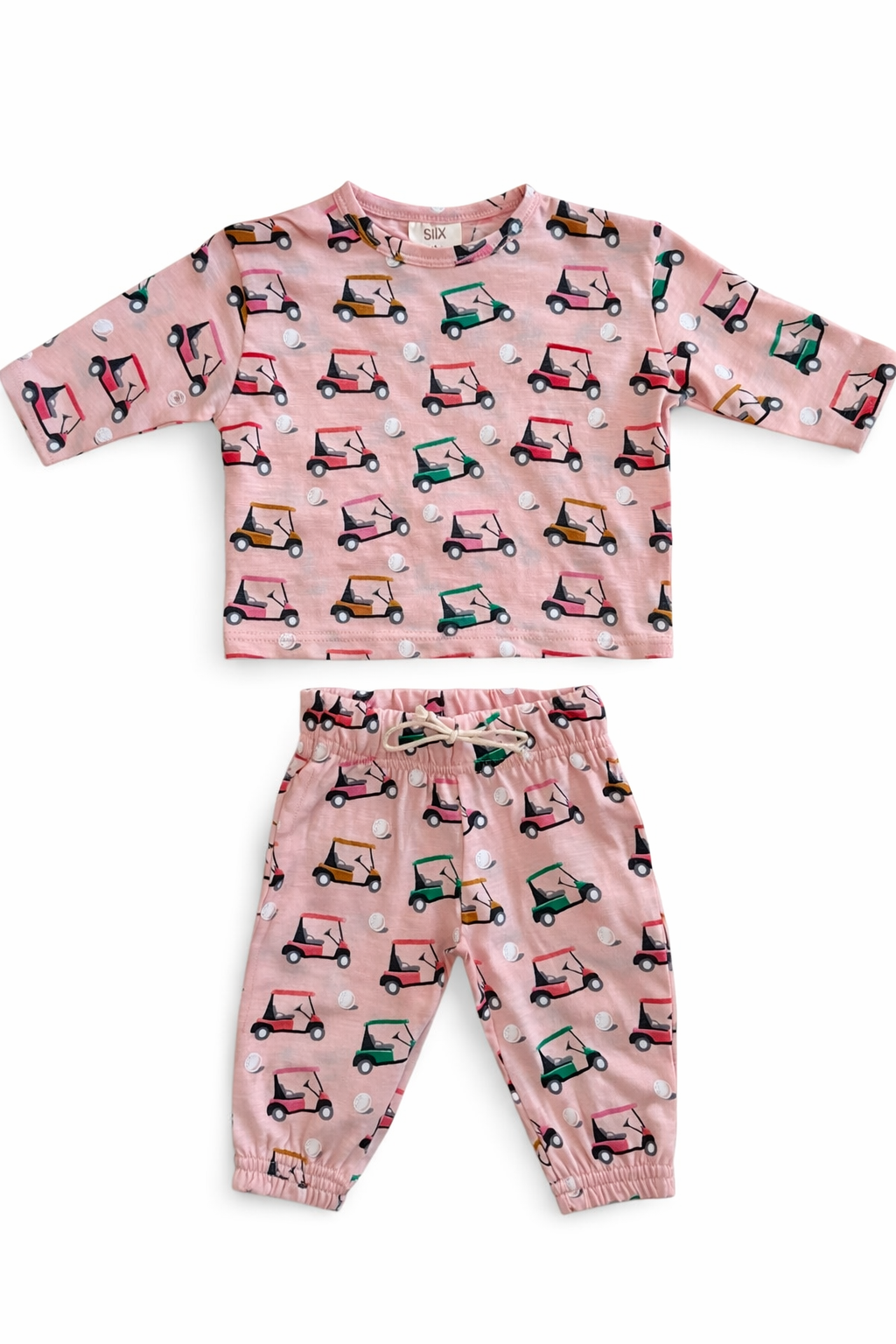 Pink children's outfit featuring a golf cart pattern, consisting of a top and matching pants.