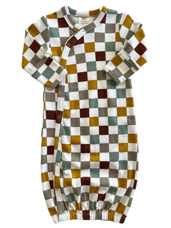 Colorful checkered baby gown in yellow, brown, green, and white pattern with snap closure and gathered bottom.