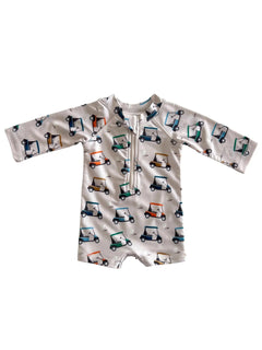 Children's rash guard with golf cart print, featuring long sleeves and a front zipper. Ideal for sun protection.