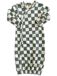 Green and white checkered baby romper with long sleeves and snap closures. Soft cotton fabric for infants.