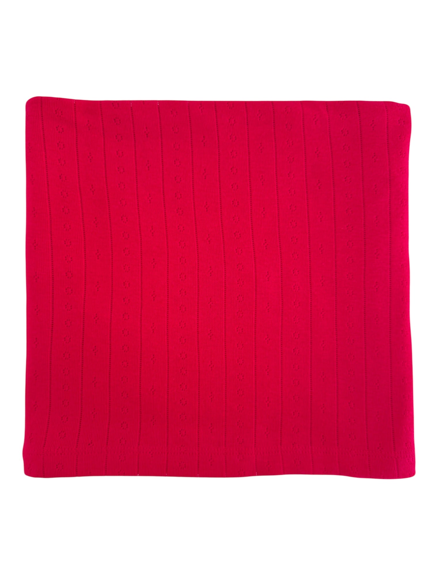 Red knitted blanket with a textured pattern of vertical lines and small flowers.