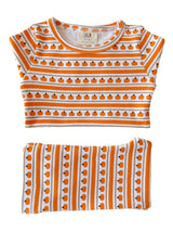 Pumpkin-patterned organic cotton children's outfit in orange and white stripes. Ideal for fall festivities.