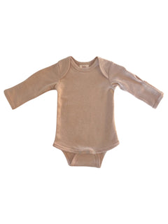 Beige long-sleeve baby bodysuit with snap buttons at the bottom, laid flat against a white background.