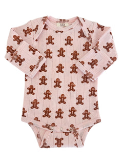 Pink baby onesie with a gingerbread man pattern on soft fabric. Long sleeves and snap closures at the bottom.