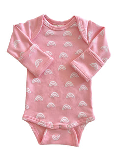 Pink baby onesie with white rainbow patterns, featuring long sleeves and snap closure at the bottom.