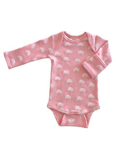 Pink long-sleeve baby bodysuit with white rainbow patterns, perfect for infants.