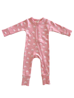 Pink baby onesie with white rainbow patterns and a front zipper. Soft fabric suitable for infants.