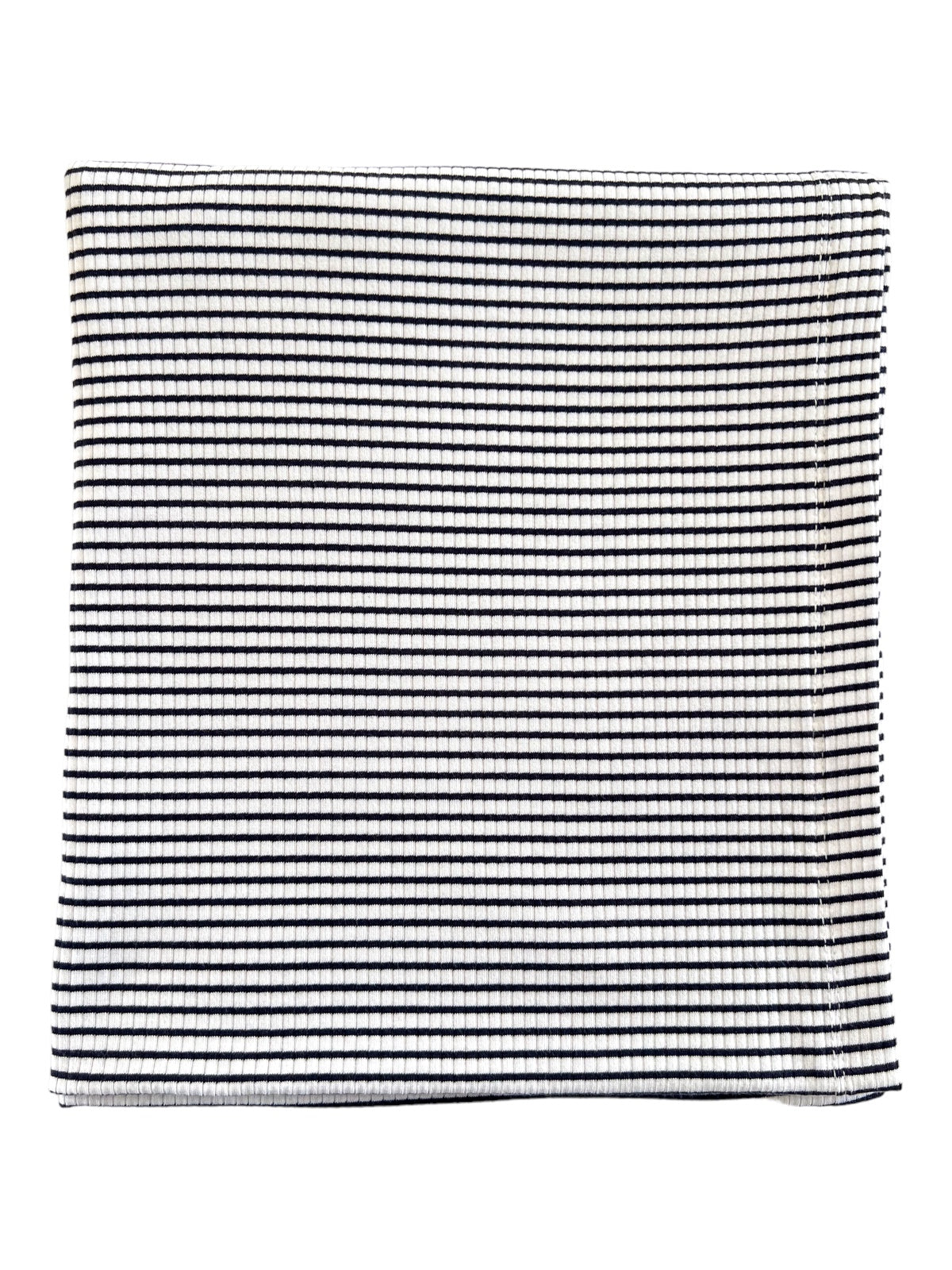 Textured fabric with alternating black and white horizontal stripes.