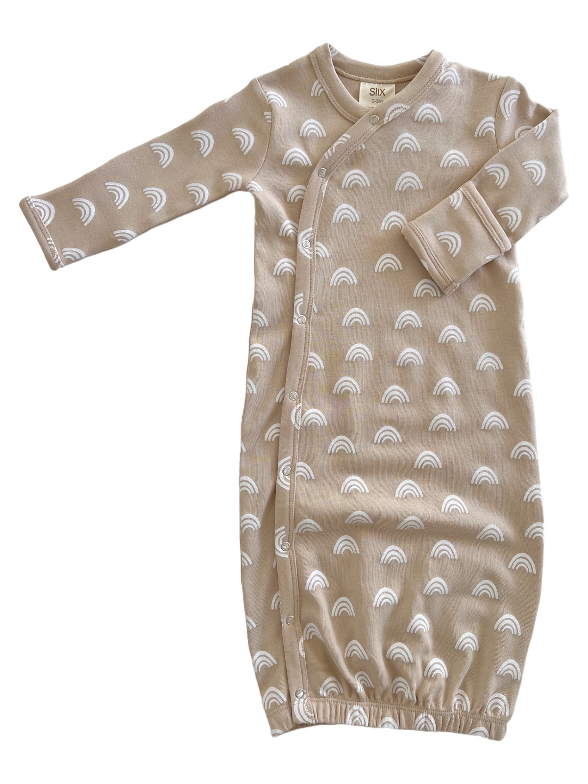 Tan baby gown with white rainbow patterns and snap buttons, designed for comfort and easy diaper changes.