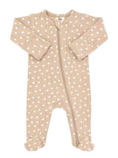 Tan baby onesie with white floral pattern and zip closure. Soft, cozy fabric for infants.