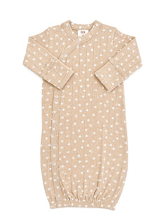Beige infant sleeping gown with white floral pattern and ribbed texture, featuring snap closures and gathered hem.