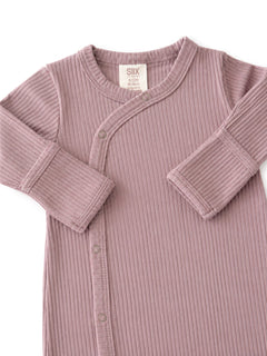 Light purple ribbed baby onesie with snap buttons and long sleeves. Suitable for ages 6 to 12 months.
