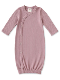 Light pink ribbed baby gown with long sleeves and snap closure, ideal for infants 0-3 months.