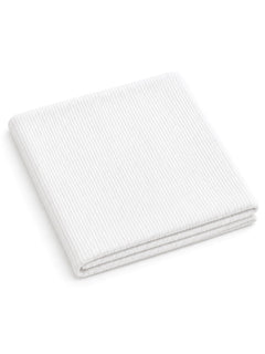 White ribbed blanket folded neatly. Ideal for cozying up or adding texture to home decor.