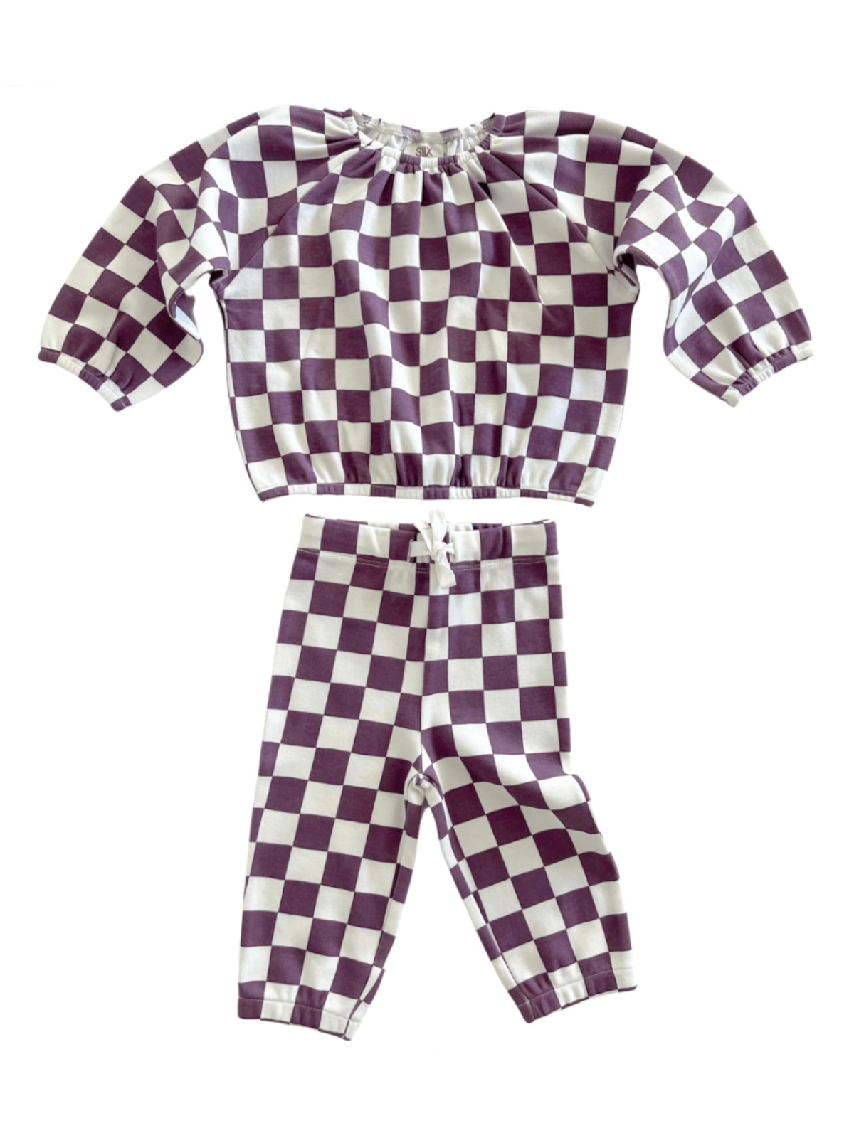 Purple and white checkered two-piece outfit with long sleeves and elastic waist pants.