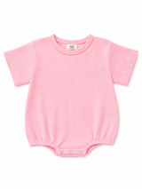 Pink ribbed baby bodysuit with short sleeves and snap closures at the bottom.