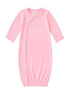 Light pink baby sleeping gown with ribbed texture and snap buttons for easy dressing. Suitable for infants 0-3 months.