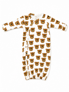 Baby onesie with playful bear face pattern on a white background, featuring long sleeves and snap closures.