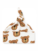 Spotted baby beanie with an adorable bear print and a knot tie on top against a white background.