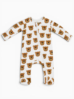 White baby onesie with bear face pattern, featuring long sleeves and a front zip closure.