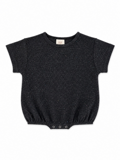 Black short-sleeve baby bodysuit with subtle colorful specks and snap closures at the bottom.