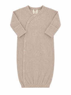 Light beige newborn sleep sack with ribbed texture and snap buttons, designed for comfort and ease of use.