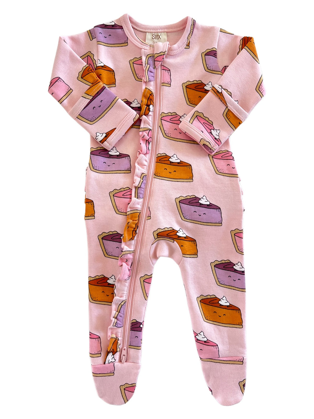 Pink baby onesie featuring colorful cake designs and a front zipper with ruffle details.
