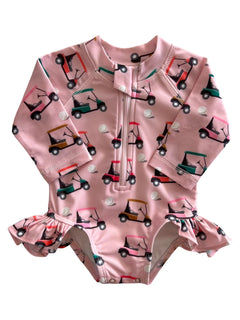 Pink swimsuit with golf cart patterns and ruffle details, featuring a front zipper for easy wear.
