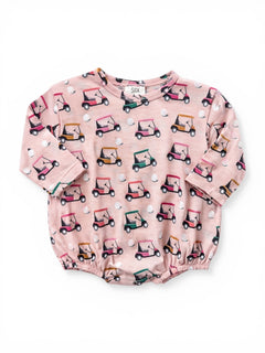 Pink baby shirt with a playful golf cart pattern and short sleeves. Perfect for casual wear.
