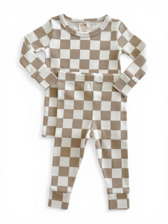 Tan and white checkered children's pajama set, featuring a long-sleeve top and matching pants.