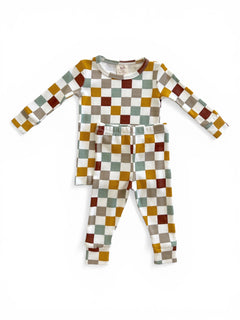 Colorful children's pajama set featuring a long-sleeve top and coordinating pants with checkerboard pattern.