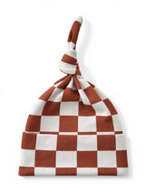 Brown and white checkered baby hat with a knot on top, displayed against a white background.