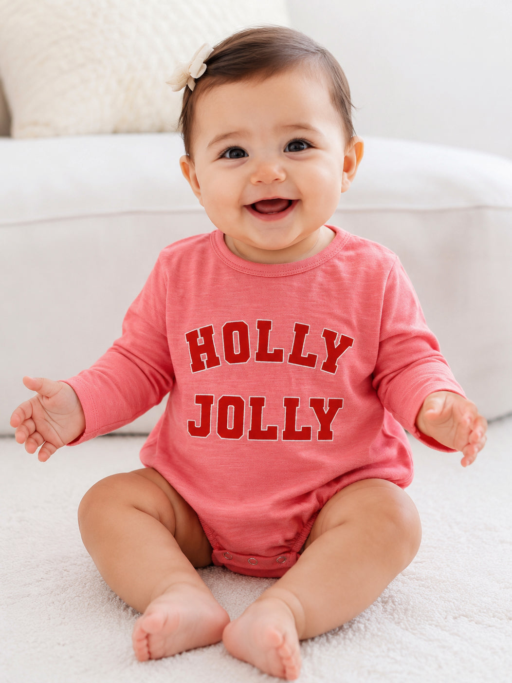 Smiling baby in a pink 