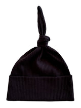 Black ribbed beanie hat with a unique knot at the top, ideal for winter fashion.